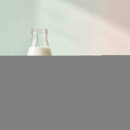 A bottle of milk on a pastel background. The concept of healthy nutrition.