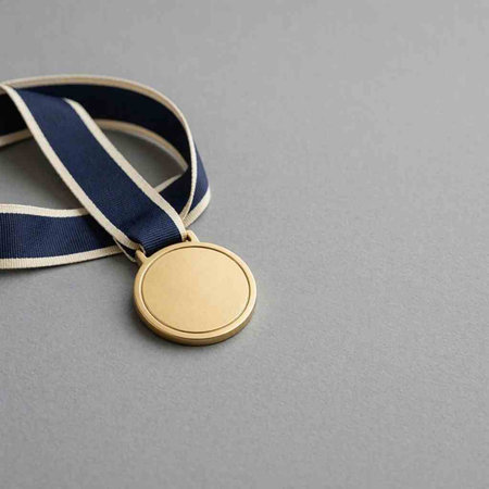 Gold medal with blue ribbon on grey background. Place for text.