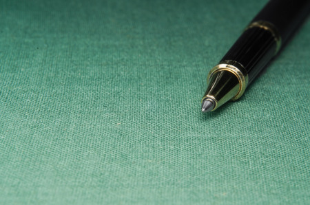 Plenty of detail in this textile background with a pen and selective focus to show dimention. Zoom in for beautiful detail. Ready for your masterpiece.の写真素材
