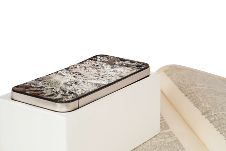 A broken smartphone on white background. の写真素材