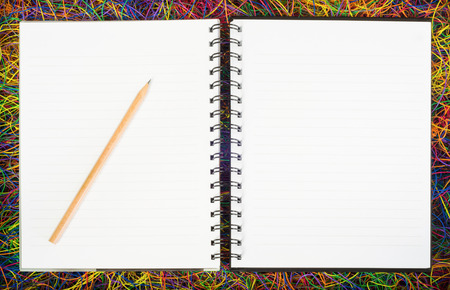 Blank spiral notepad notebooks on electric wire.の写真素材