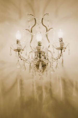Photo of an ornate luxurious entry to a modern upscale chandeliers.の写真素材