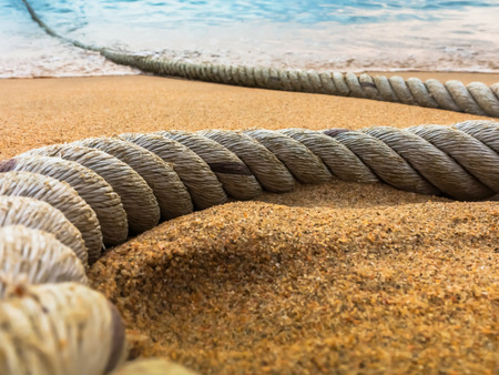 Travel locations with nautical rope on the beach at Pataya in Thailand, selective focus.の写真素材