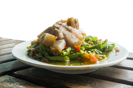 Spicy lentils salad somtam and Pried Pork, famous Thai food isolated white background with selective focus.の写真素材