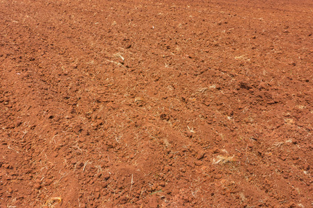 Plowing a farm field in preparation for spring planting.の写真素材
