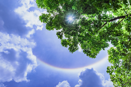 Sun halo with cloud in the blue sky.の写真素材
