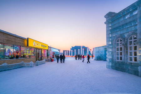 Harbin, Heilongjiang, China - January 11, 2019: Amazing architecture at the ice festival. Ice building in International Ice and Snow Sculpture Festival.  Located in China Harbin Ice and Snow World on sun island in winter that Tourists are visiting.のeditorial素材