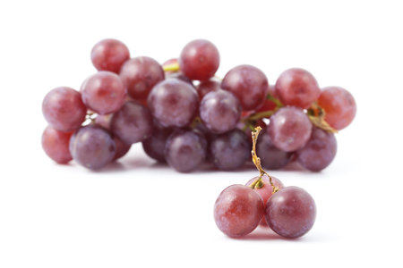 red grape isolated on whiteの写真素材