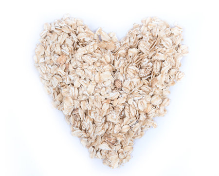 Oat flakes pile on white background