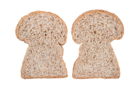 whole wheat bread slices isolated on whiteの写真素材