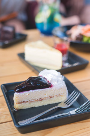 blueberry cheesecake on wooden tableの写真素材