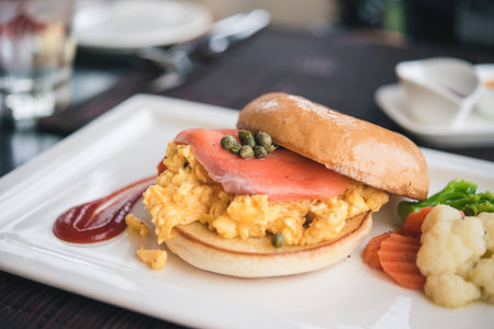 scrambled eggs with smoke salmon and toastの写真素材