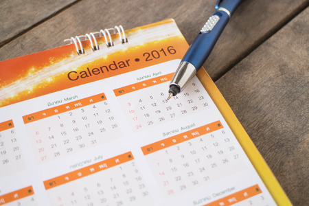 Calendar 2016 on wood backgroundの写真素材
