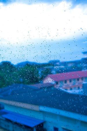 Rainy drop on glassの写真素材