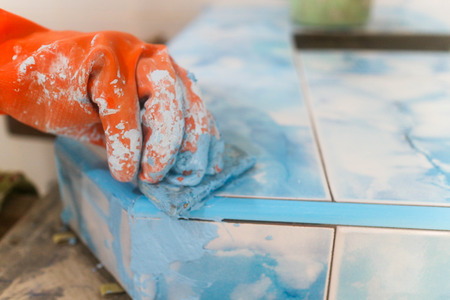 Home renovation - worker tilerの写真素材