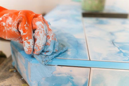 Home renovation - worker tilerの写真素材