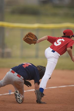 Two baseball players in a tight playの写真素材