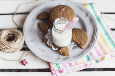 Rustic home made tasty  cookies on the wooden background with milkの写真素材