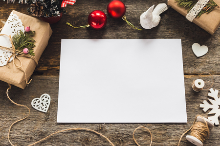 Stylish brending mockup to display your artworks. Cute vintage christmas new year gifts mock up on wooden background.の写真素材