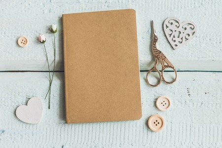Stylish brending mockup to display your artworks. Cute vintage mock up on wooden background.