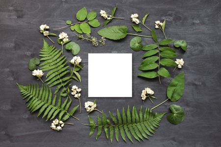 Cute and stylish branding mockup with wild flowers. Flat lay top view photo of a feminine layout.