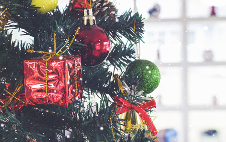 Decorated Christmas tree on blurred, sparkling and fairy background. over light and vintage toneの写真素材