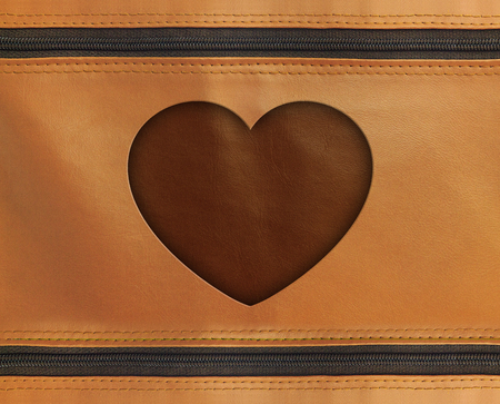 valentine concept. heart carved on a leather textureの写真素材