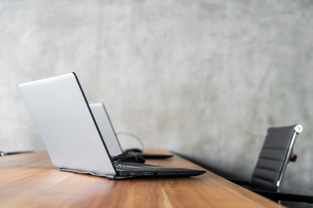 business concept .computer laptop on the office with soft-focus and over light in the background