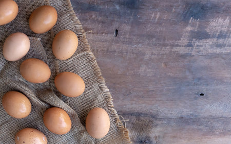 closeup egg on wood background. top viewの写真素材