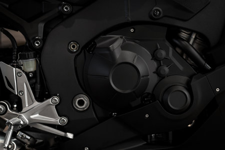 closeup motorcycle engine with soft-focus and over light in the background