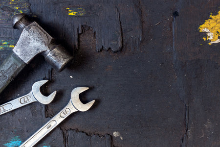 closeup set of tools for motorbike repair on dark background. top viewの写真素材