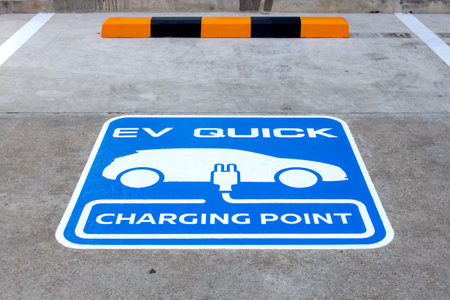 closeup charging point for electric car with soft-focus and over light in the backgroundの写真素材