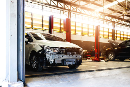 car in automobile repair service center with soft-focus and over light in the background