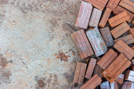 red bricks on cement floor in construction site. top viewの写真素材