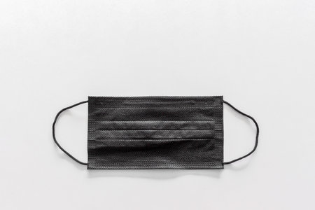 health concept. black mask on white backgroundの写真素材