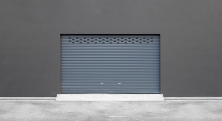 street wall background. roller shutter door and concrete floor outside factory building for industrialの写真素材