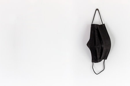 health concept. black mask on white backgroundの写真素材