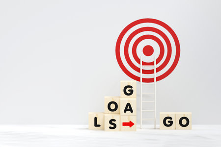 business and education concept. wooden cubes and stand white ladder to goal target with copy space....