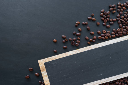 wooden sign and coffee beans on wooden table background. mockup and templates to create greeting,...