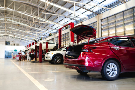 car in automobile repair service center with soft-focus and over light in the background