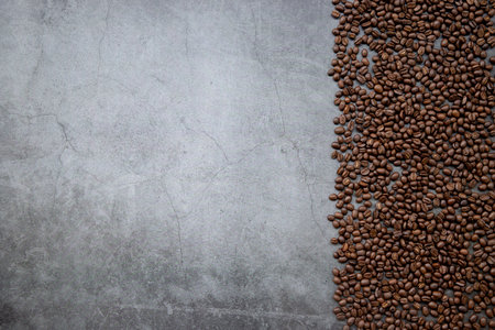 coffee bean on old cement floor background. top view. space for textの写真素材