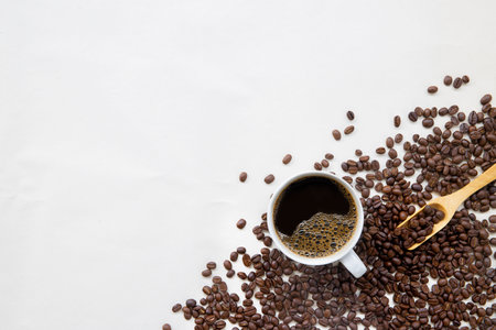 hot coffee and bean on white paper background. mockup and templates to create greeting, cards, magazines, cover, poster and banners etc. space for text. top view. flat layの写真素材