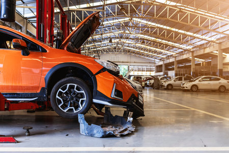 car in automobile repair service center with soft-focus and over light in the backgroundの写真素材