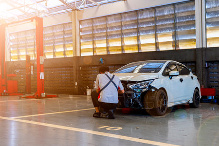 car in automobile repair service center with soft-focus and over light in the backgroundの写真素材