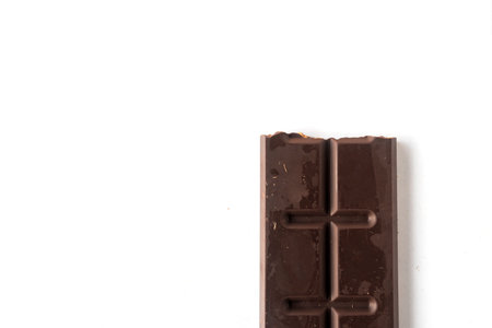 Flat lay composition with delicious chocolate on white table backgroundの写真素材