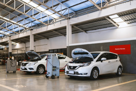 car repair in garage service station with soft-focus and over light in the backgroundの写真素材