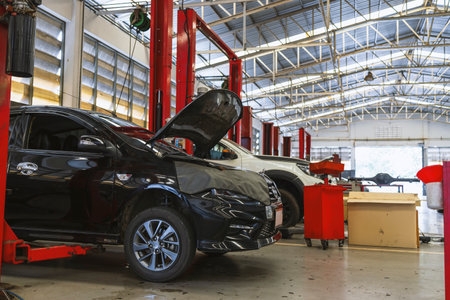 car in automobile repair service center with soft-focus and over light in the background