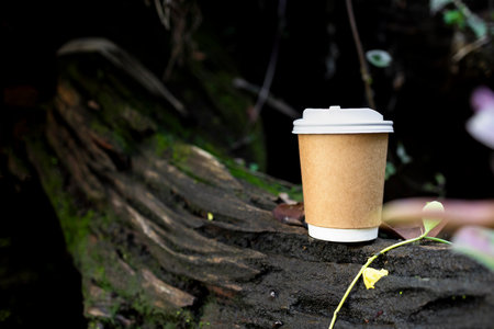 Indulge in the delightful aroma of hot coffee amidst a serene green garden. Experience the perfect blend of nature and relaxation with our inviting cafÃ© sceneの写真素材
