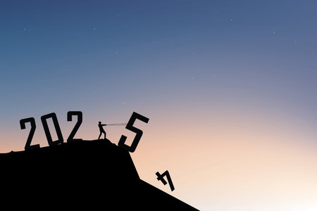 Silhouette of Businessman pulling the number 5 to complete 2025 on a mountaintop under a full moon,...