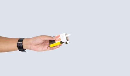 Anti-smoking concept featuring a hand blocking a cigarette pack offer, emphasizing health awareness...